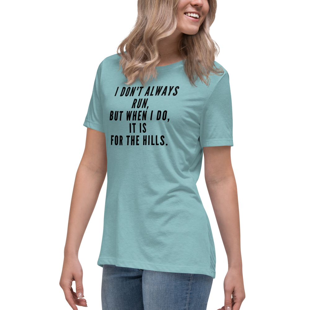 "I don't always run, but when I do, it is for the hills." printed on a heather blue lagoon women's relaxed t-shirt worn by a female
