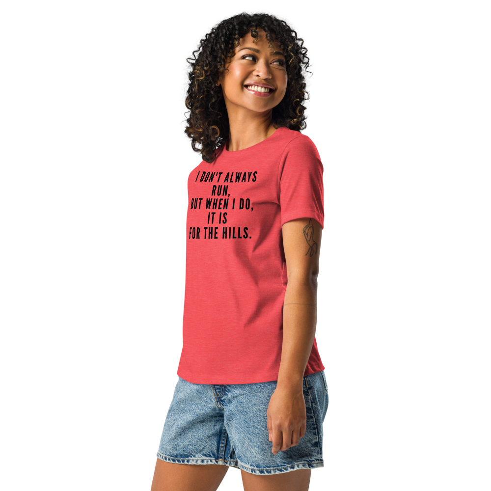 "I don't always run, but when I do, it is for the hills." printed on a heather red women's relaxed t-shirt worn by a female