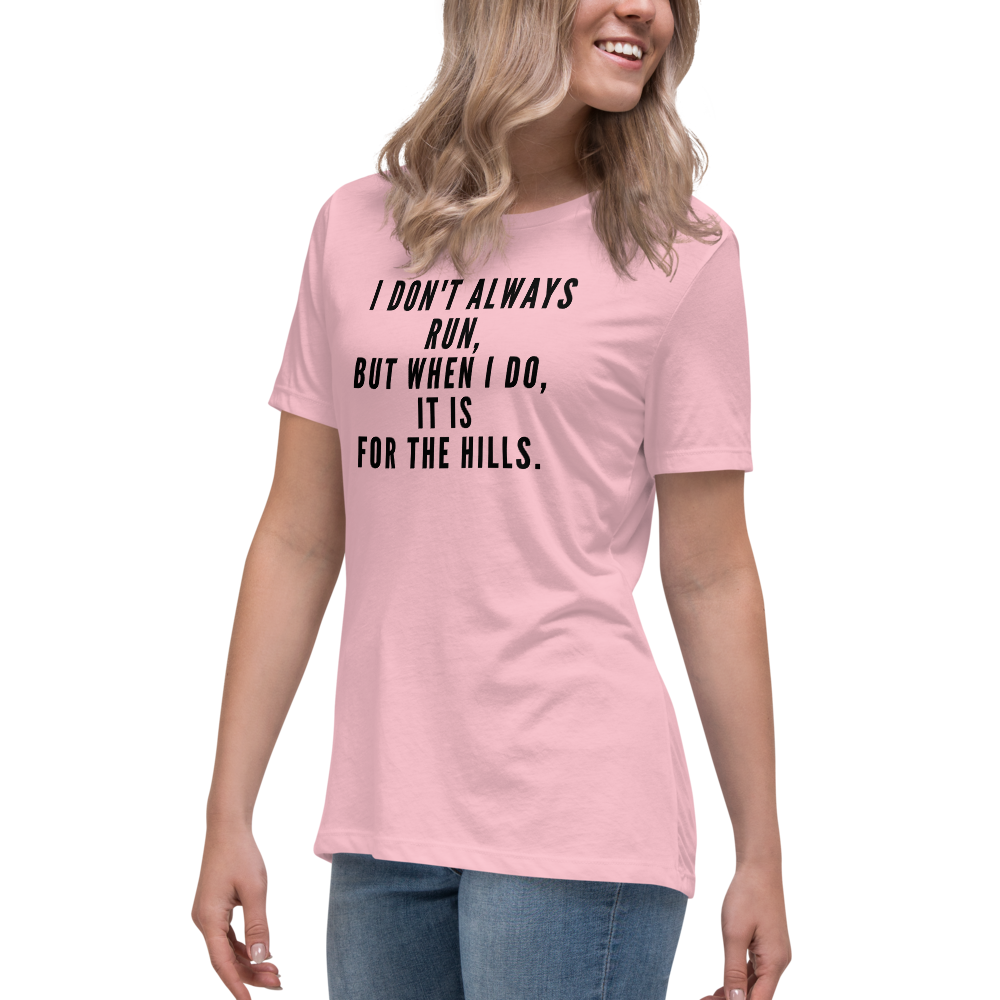 "I don't always run, but when I do, it is for the hills." printed on a pink women's relaxed t-shirt worn by a female