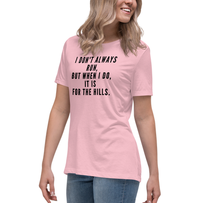"I don't always run, but when I do, it is for the hills." printed on a pink women's relaxed t-shirt worn by a female