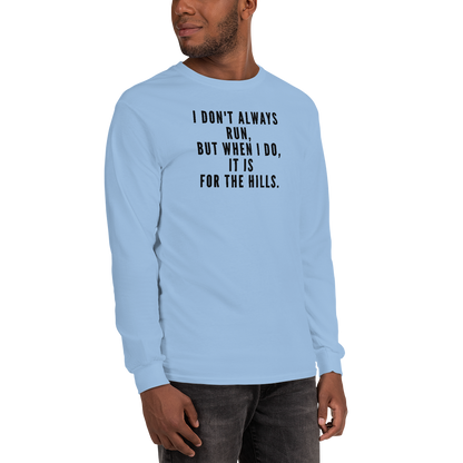 "I don't always run, but when I do, it is for the hills." printed on a light blue men's long sleeve shirt worn by a male