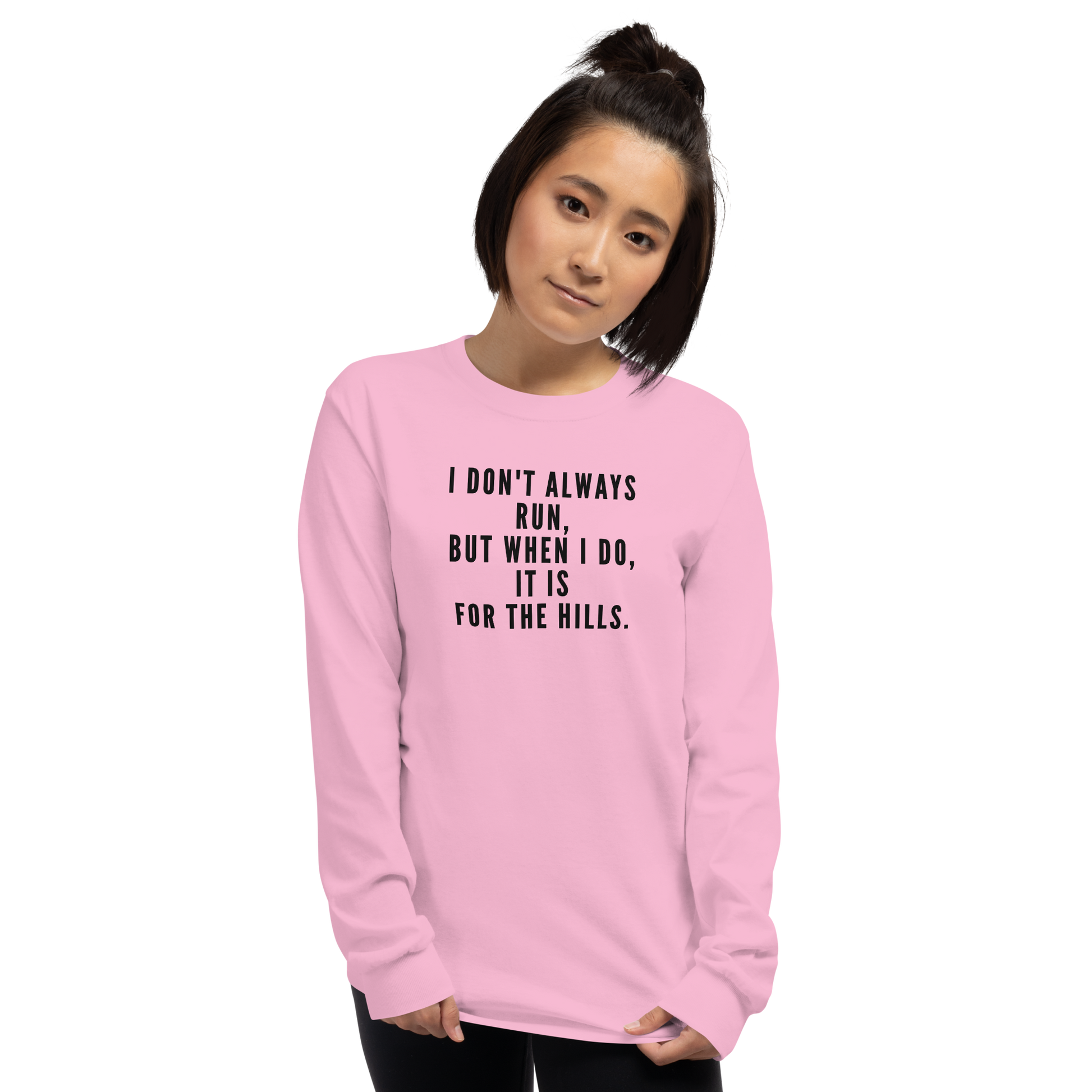 "I don't always run, but when I do, it is for the hills." printed on a light pink men's long sleeve shirt worn by a female