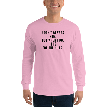 "I don't always run, but when I do, it is for the hills." printed on a light pink men's long sleeve shirt worn by a male