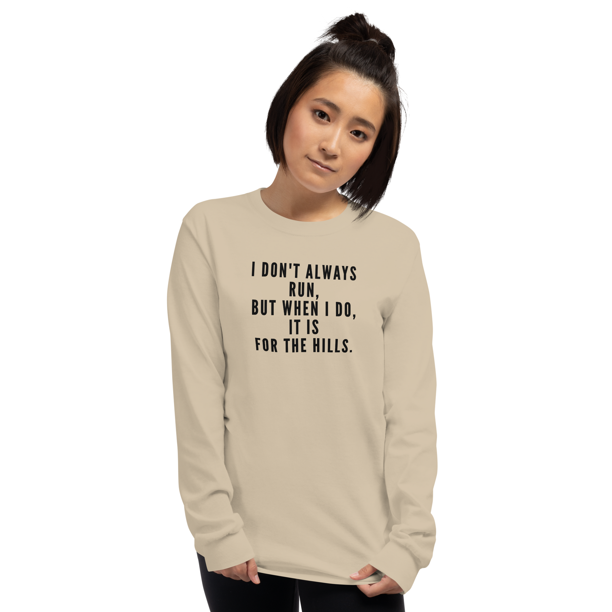 "I don't always run, but when I do, it is for the hills." printed on a sand men's long sleeve shirt worn by a female