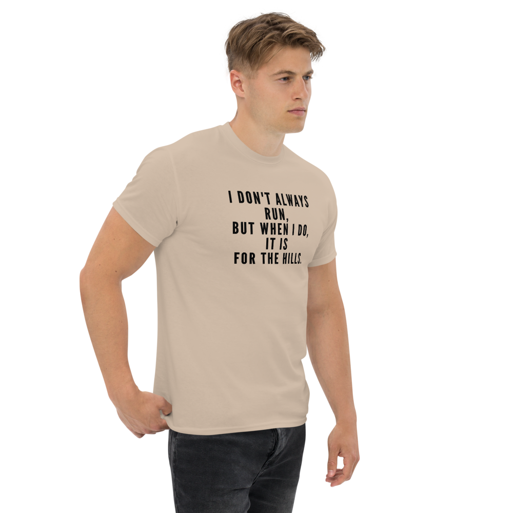 "I don't always run, but when I do, it is for the hills." printed on a sand unisex classic tee worn by a male