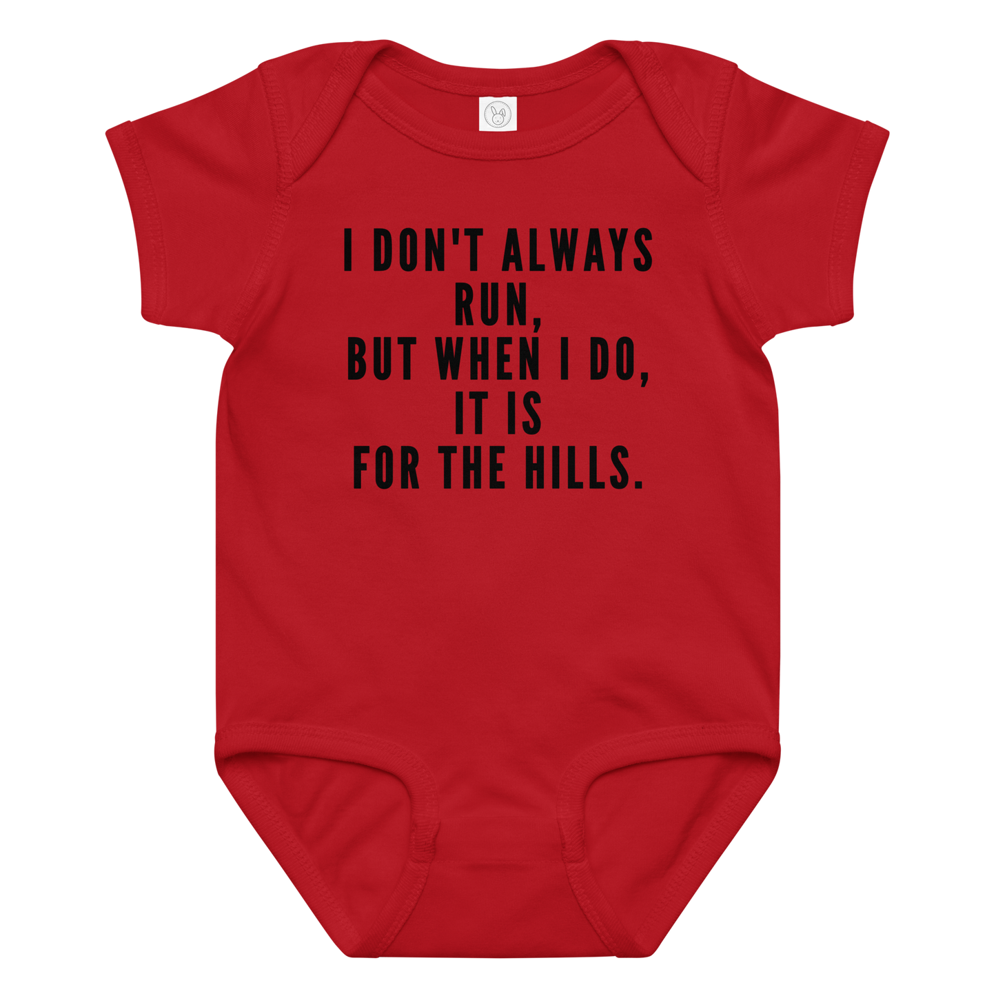 "I don't always run, but when I do, it is for the hills." printed on a red baby jersey bodysuit laying on a flat surface amongst other clothes