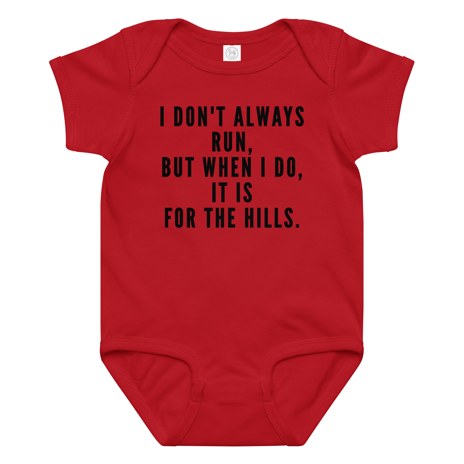 "I don't always run, but when I do, it is for the hills." printed on a red baby jersey bodysuit laying on a flat surface amongst other clothes