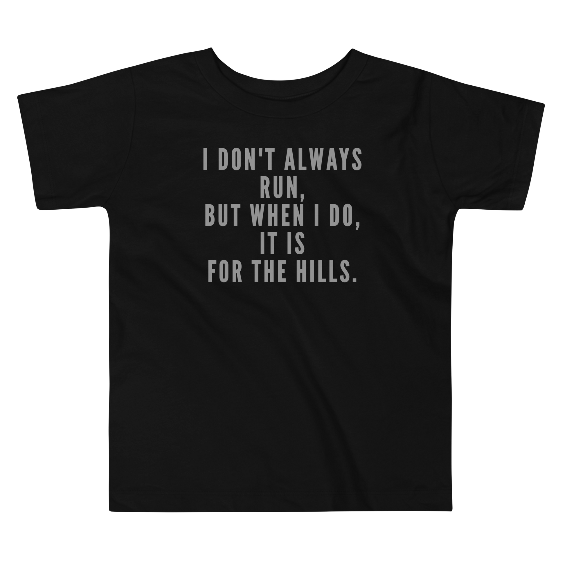 "I don't always run, but when I do, it is for the hills." printed on a black toddler short sleeve tee laying on a flat surface
