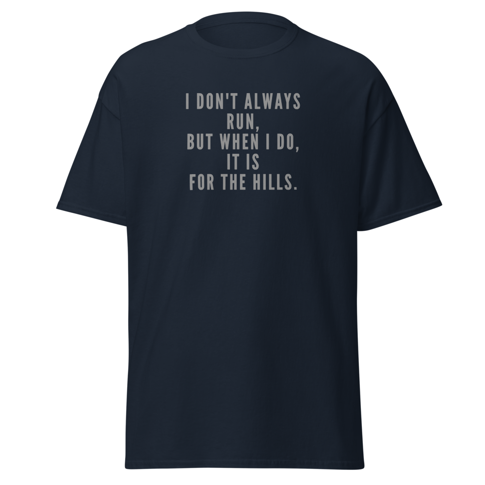 "I don't always run, but when I do, it is for the hills." printed on a navy unisex classic tee laying on a flat surface