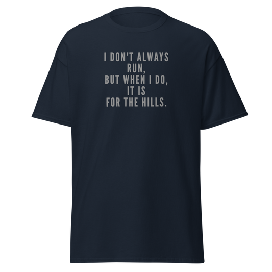 "I don't always run, but when I do, it is for the hills." printed on a navy unisex classic tee laying on a flat surface