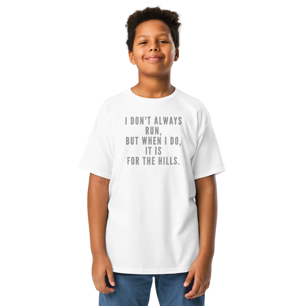 "I don't always run, but when I do, it is for the hills." printed on a white youth classic tee worn by a male