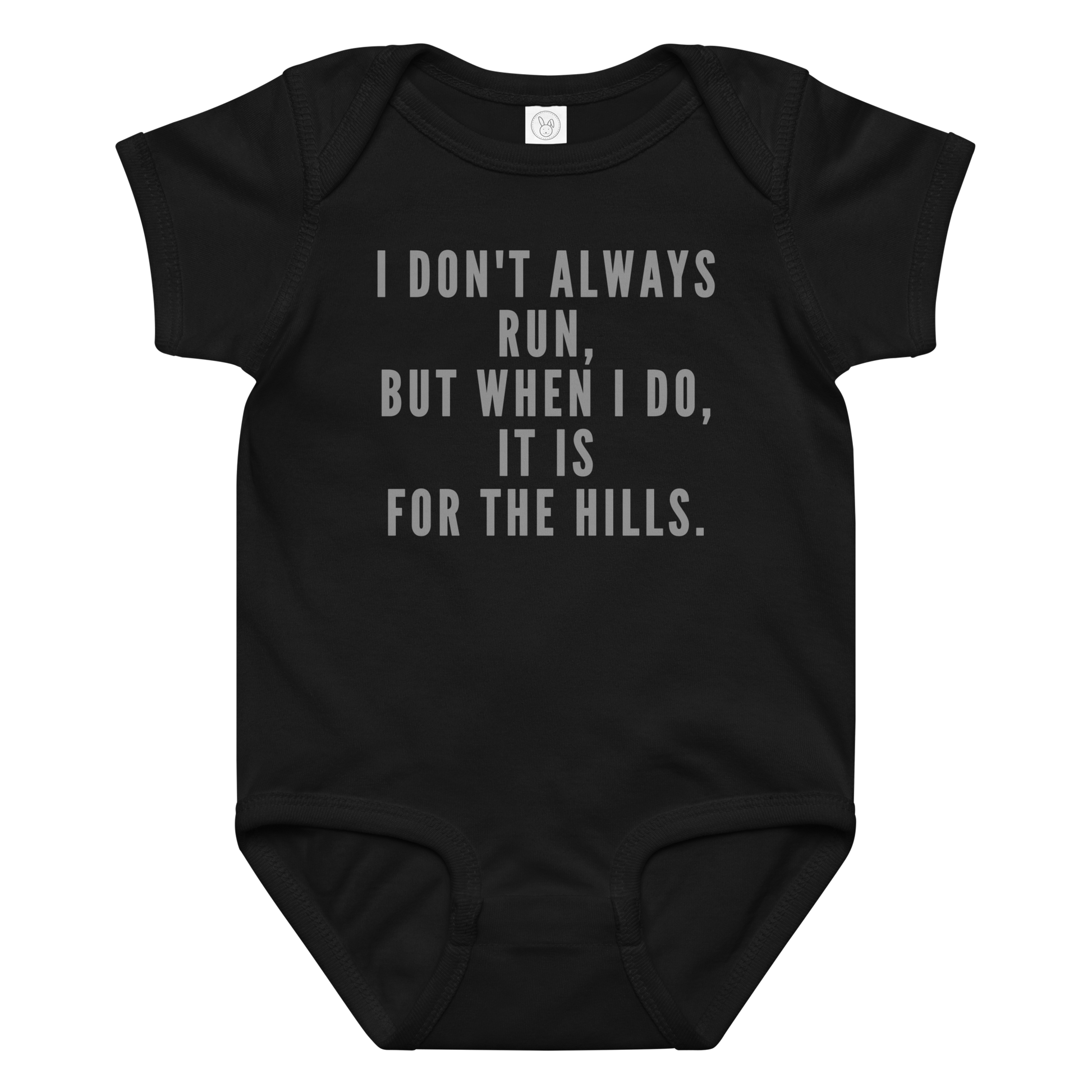 "I don't always run, but when I do, it is for the hills." printed on a black baby jersey bodysuit laying on a flat surface amongst other clothes