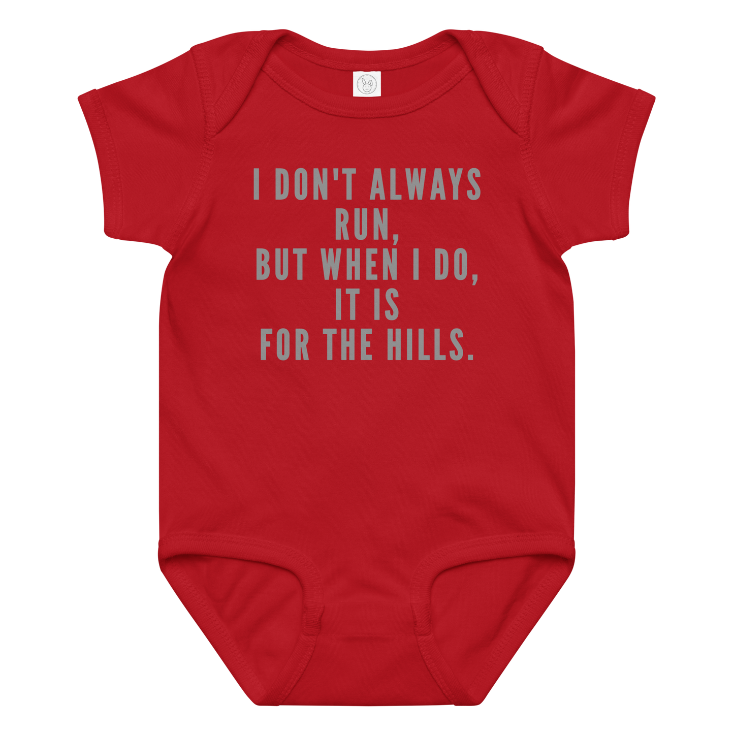 "I don't always run, but when I do, it is for the hills." printed on a red baby jersey bodysuit laying on a flat surface amongst other clothes