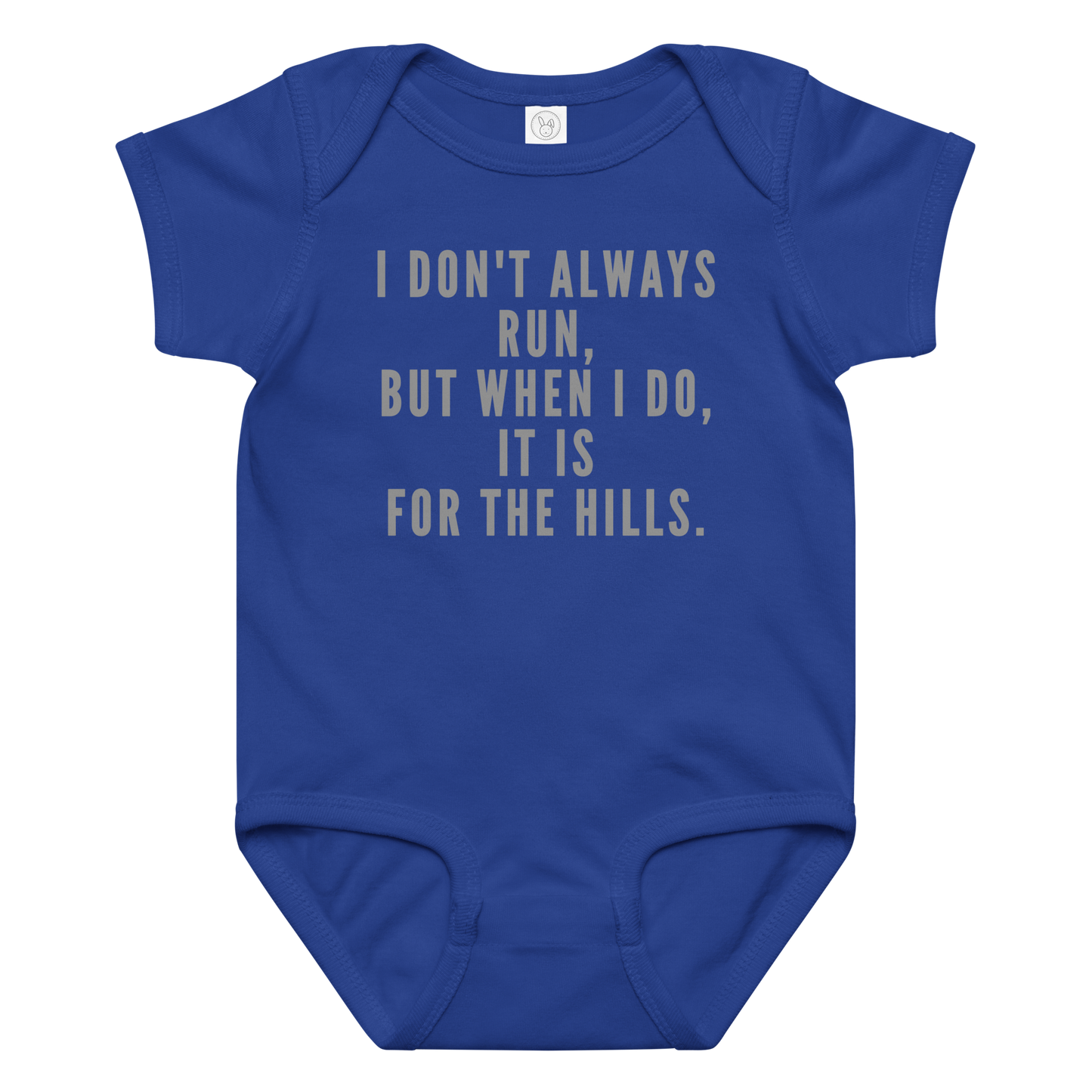"I don't always run, but when I do, it is for the hills." printed on a royal baby jersey bodysuit laying on a flat surface amongst other clothes