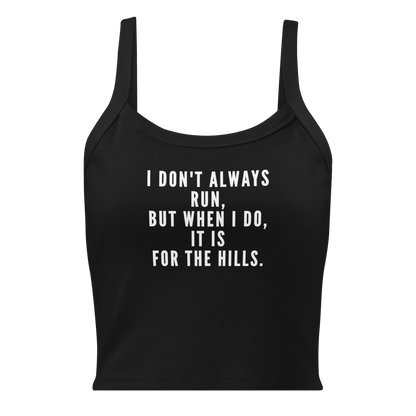 "I don't always run, but when I do, it is for the hills." printed on a solid black blend women's micro-rib tanktop laying on a flat surface