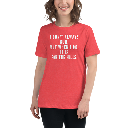 "I don't always run, but when I do, it is for the hills." printed on a heather red women's relaxed t-shirt worn by a female