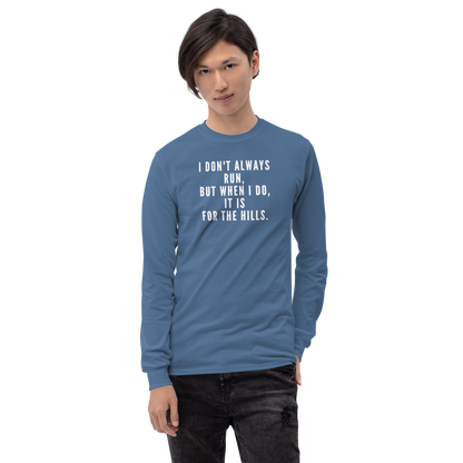 "I don't always run, but when I do, it is for the hills." printed on a indigo blue men's long sleeve shirt worn by a male