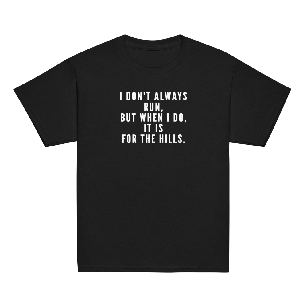 "I don't always run, but when I do, it is for the hills." printed on a black youth classic tee laying on a flat surface