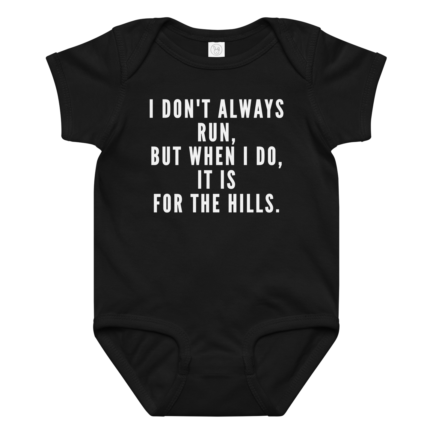 "I don't always run, but when I do, it is for the hills." printed on a black baby jersey bodysuit laying on a flat surface amongst other clothes