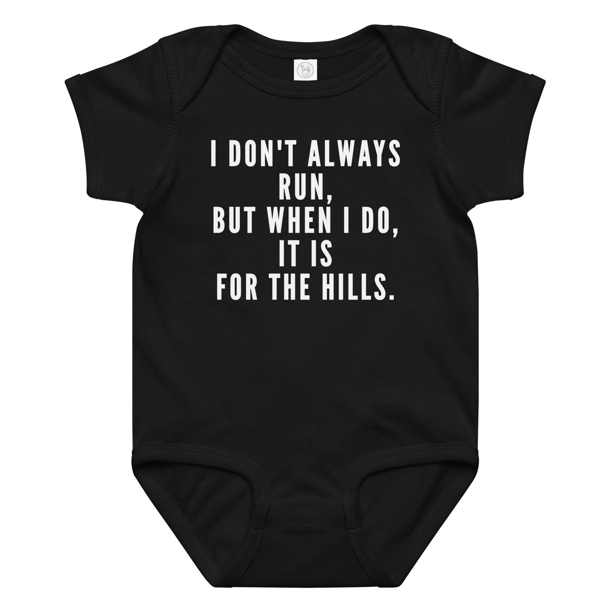 "I don't always run, but when I do, it is for the hills." printed on a black baby jersey bodysuit laying on a flat surface amongst other clothes