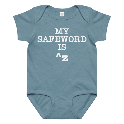 "My Safe Word Is ^Z" printed on a vintage indigo baby jersey bodysuit laying on a flat surface amongst other clothes