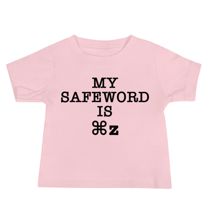 "My Safe Word Is ⌘Z" printed on a pink baby jersey short sleeve tee laying on a flat surface