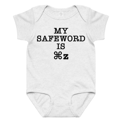 "My Safe Word Is ⌘Z" printed on a ash baby jersey bodysuit laying on a flat surface amongst other clothes