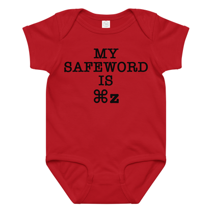 "My Safe Word Is ⌘Z" printed on a red baby jersey bodysuit laying on a flat surface amongst other clothes