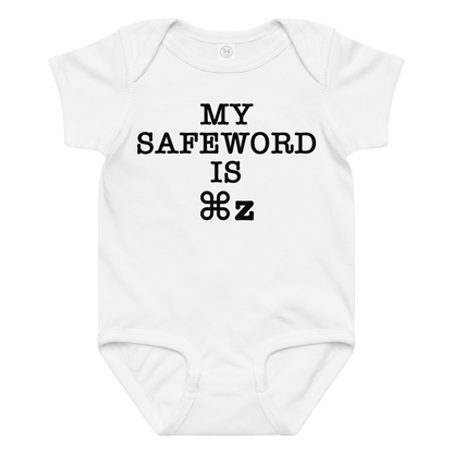 "My Safe Word Is ⌘Z" printed on a white baby jersey bodysuit laying on a flat surface amongst other clothes