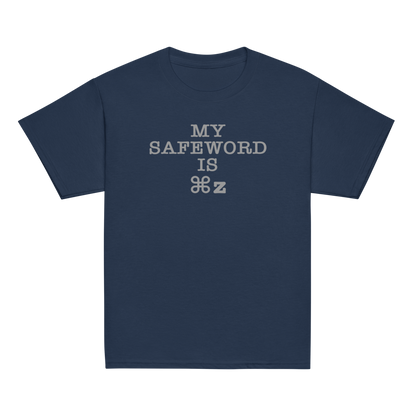 "My Safe Word Is ⌘Z" printed on a navy youth classic tee laying on a flat surface