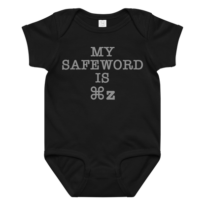 "My Safe Word Is ⌘Z" printed on a black baby jersey bodysuit laying on a flat surface amongst other clothes