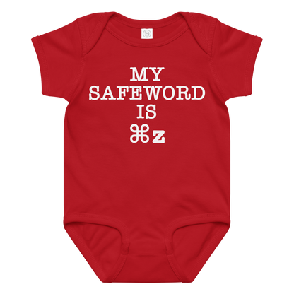 "My Safe Word Is ⌘Z" printed on a red baby jersey bodysuit laying on a flat surface amongst other clothes
