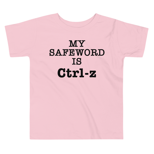 "My Safe Word Is Ctrl-Z" printed on a pink toddler short sleeve tee laying on a flat surface