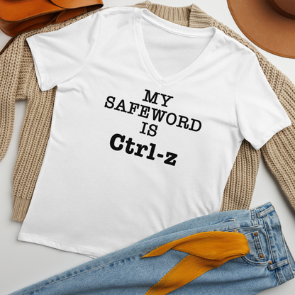 "My Safe Word Is Ctrl-Z" printed on a solid white blend women's relaxed v-neck t-shirt laying on a flat surface amongst other clothes