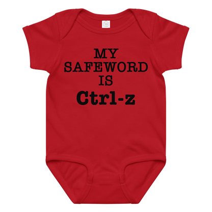 "My Safe Word Is Ctrl-Z" printed on a red baby jersey bodysuit laying on a flat surface amongst other clothes