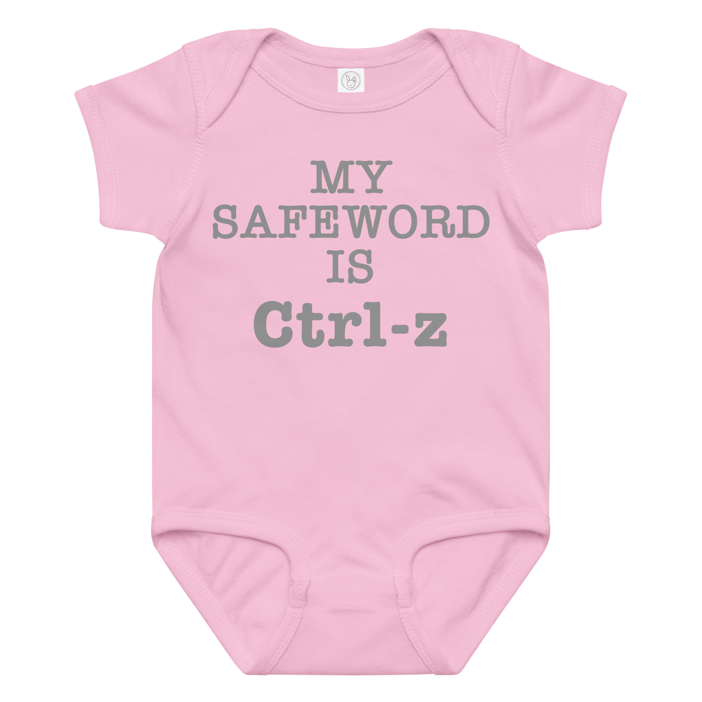 "My Safe Word Is Ctrl-Z" printed on a pink baby jersey bodysuit laying on a flat surface amongst other clothes