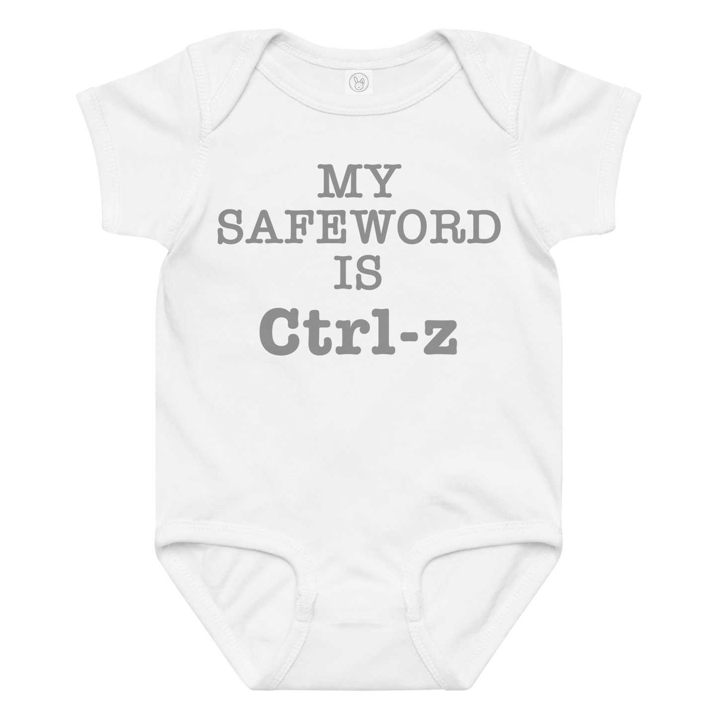 "My Safe Word Is Ctrl-Z" printed on a white baby jersey bodysuit laying on a flat surface amongst other clothes