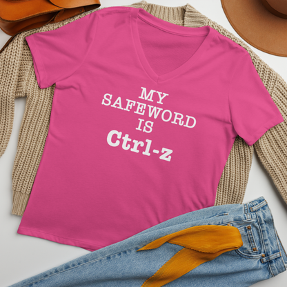 "My Safe Word Is Ctrl-Z" printed on a berry women's relaxed v-neck t-shirt laying on a flat surface amongst other clothes