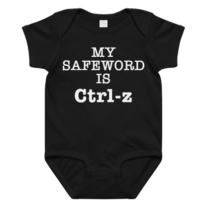 "My Safe Word Is Ctrl-Z" printed on a black baby jersey bodysuit laying on a flat surface amongst other clothes