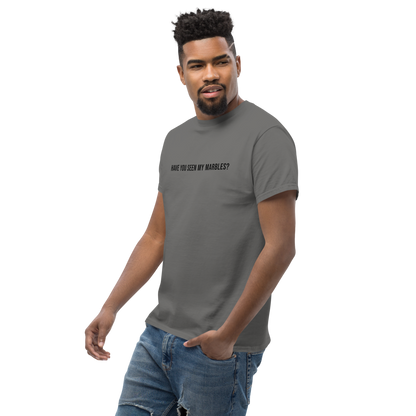 "Have you seen my marbles?" printed on a charcoal unisex classic tee worn by a male