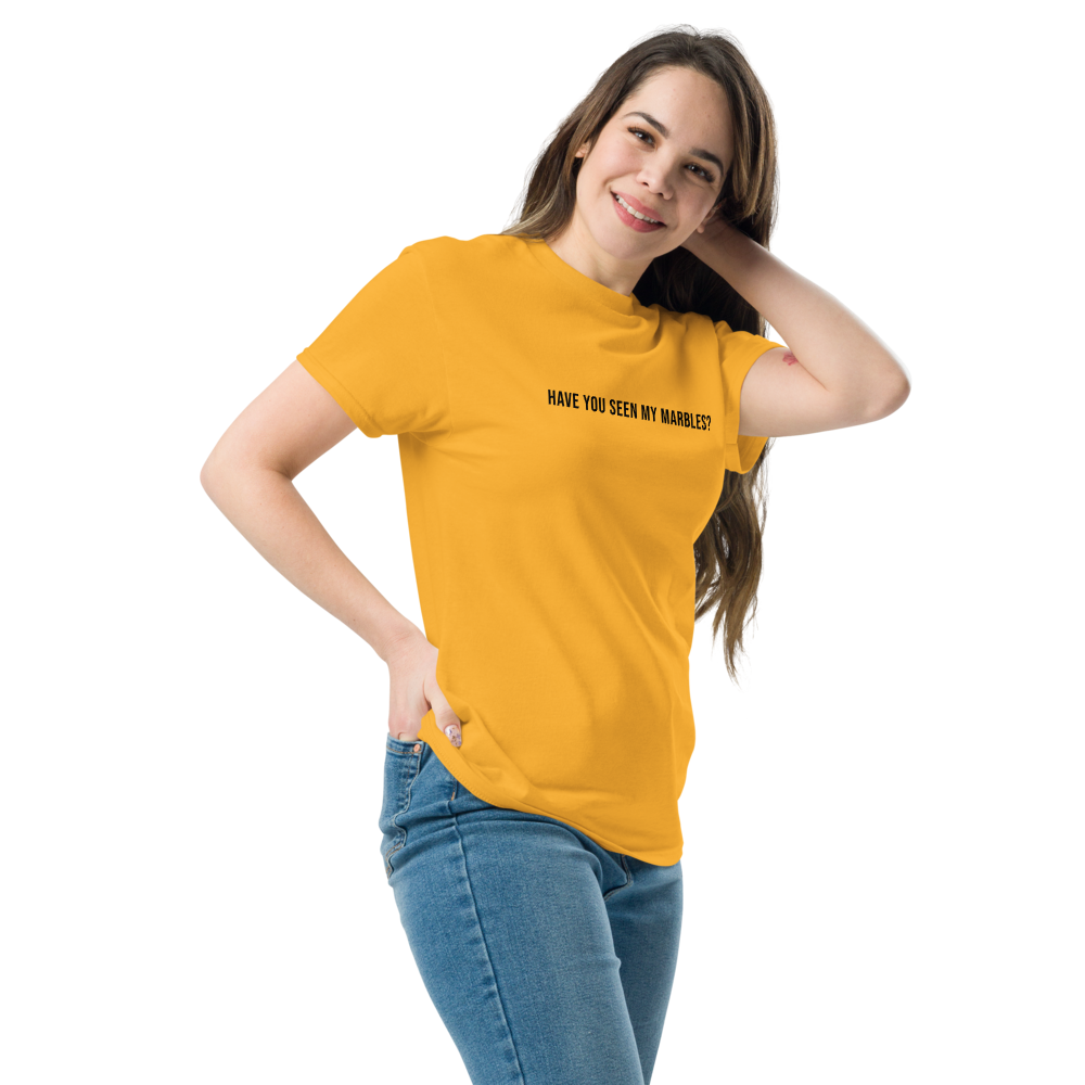 "Have you seen my marbles?" printed on a gold unisex classic tee worn by a female