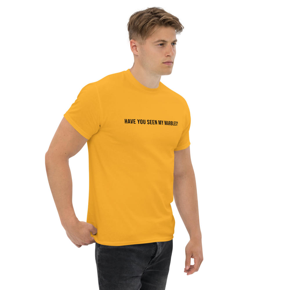 "Have you seen my marbles?" printed on a gold unisex classic tee worn by a male