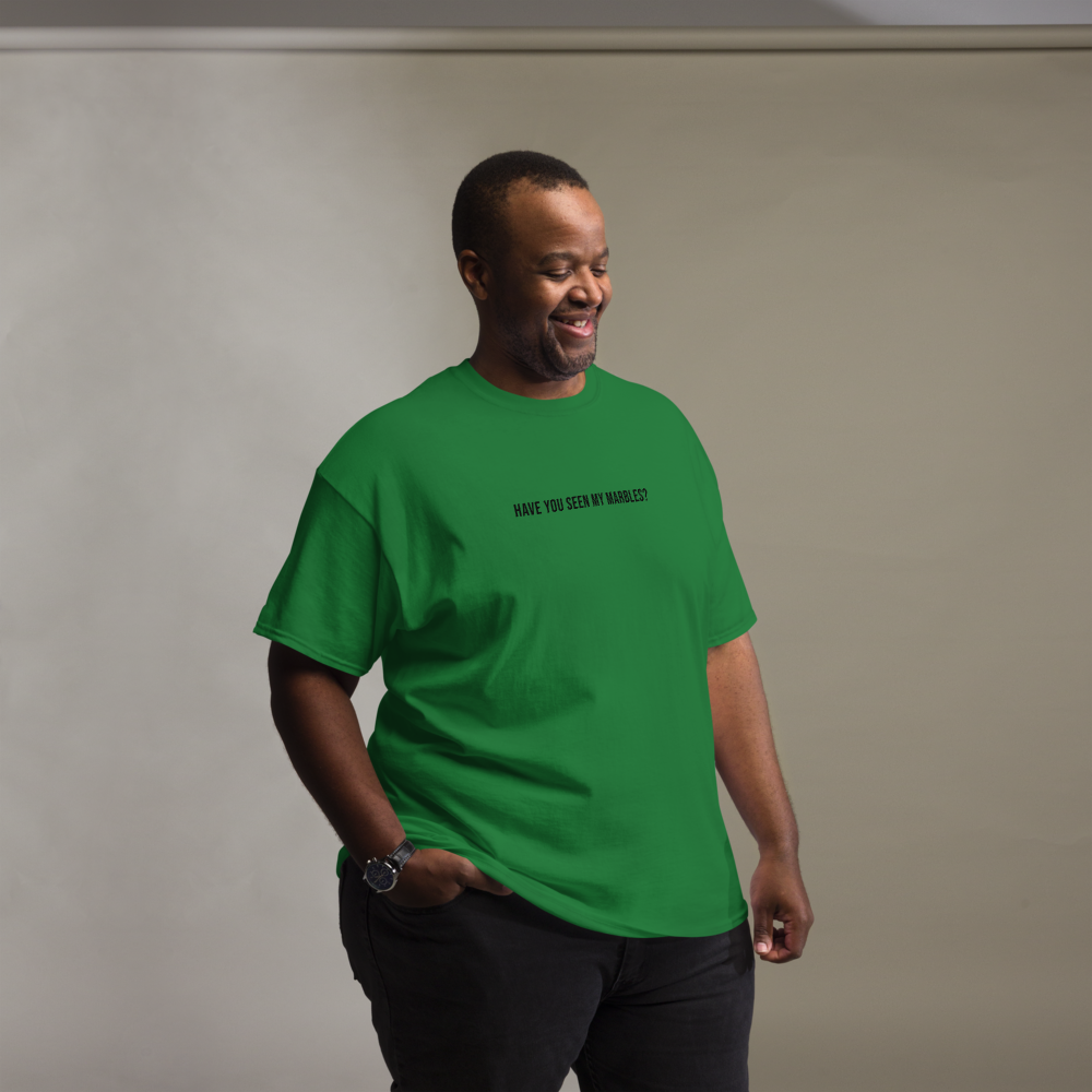 "Have you seen my marbles?" printed on a turf green unisex classic tee worn by a male