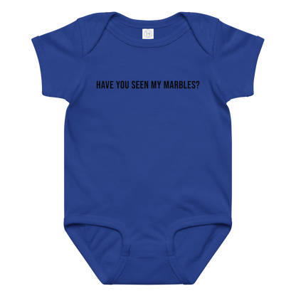 "Have you seen my marbles?" printed on a royal baby jersey bodysuit laying on a flat surface amongst other clothes