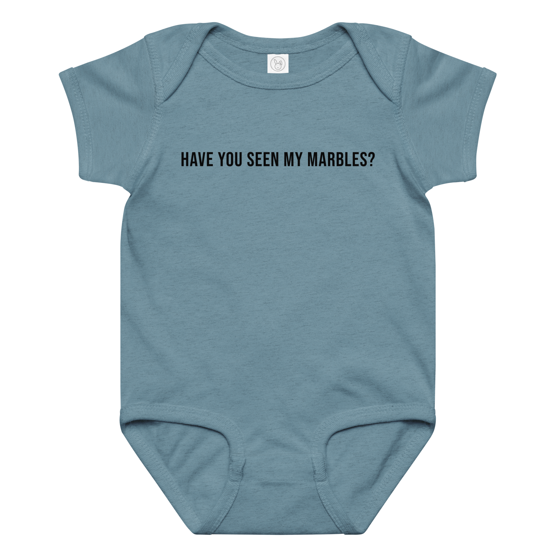 "Have you seen my marbles?" printed on a vintage indigo baby jersey bodysuit laying on a flat surface amongst other clothes