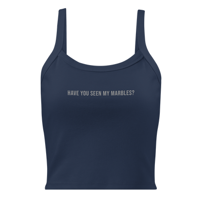 "Have you seen my marbles?" printed on a solid navy blend women's micro-rib tanktop laying on a flat surface