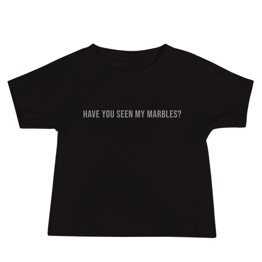 "Have you seen my marbles?" printed on a black baby jersey short sleeve tee laying on a flat surface