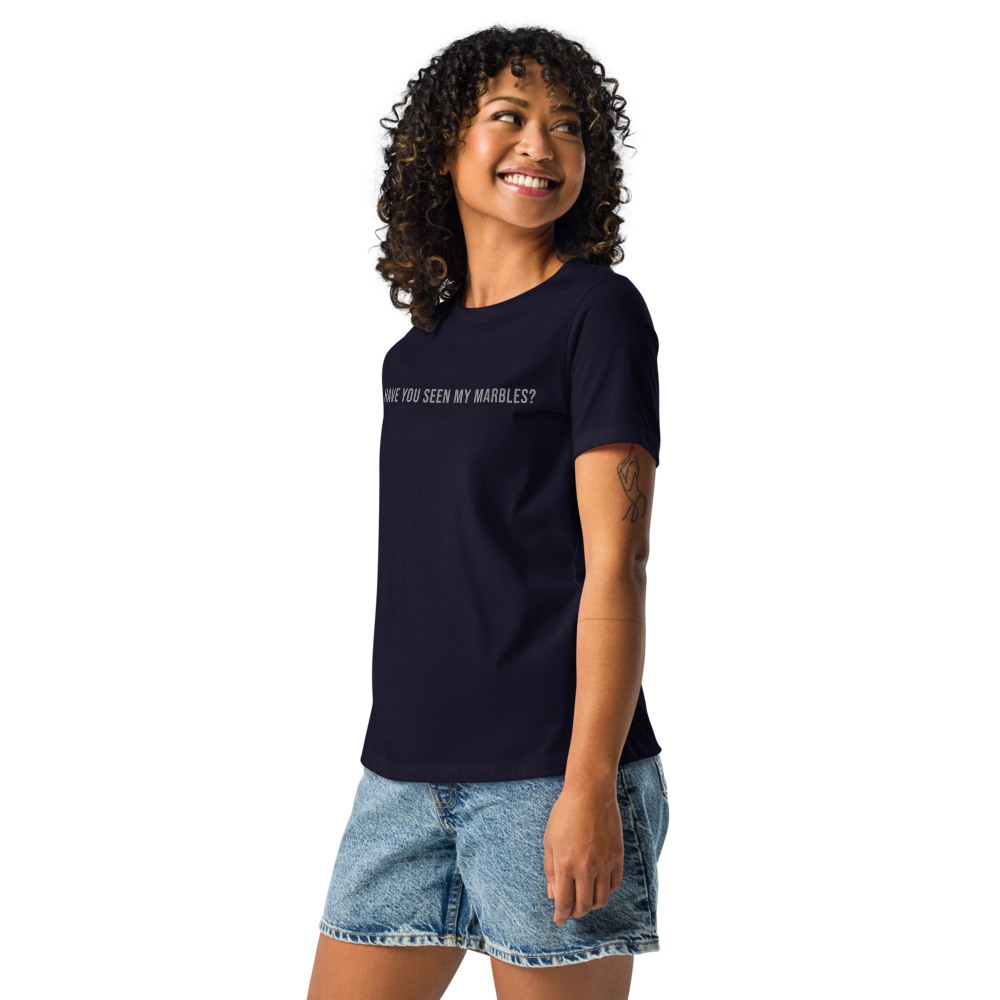 "Have you seen my marbles?" printed on a navy women's relaxed t-shirt worn by a female