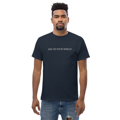 "Have you seen my marbles?" printed on a navy unisex classic tee worn by a male