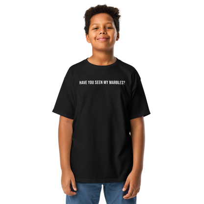 "Have you seen my marbles?" printed on a black youth classic tee worn by a male
